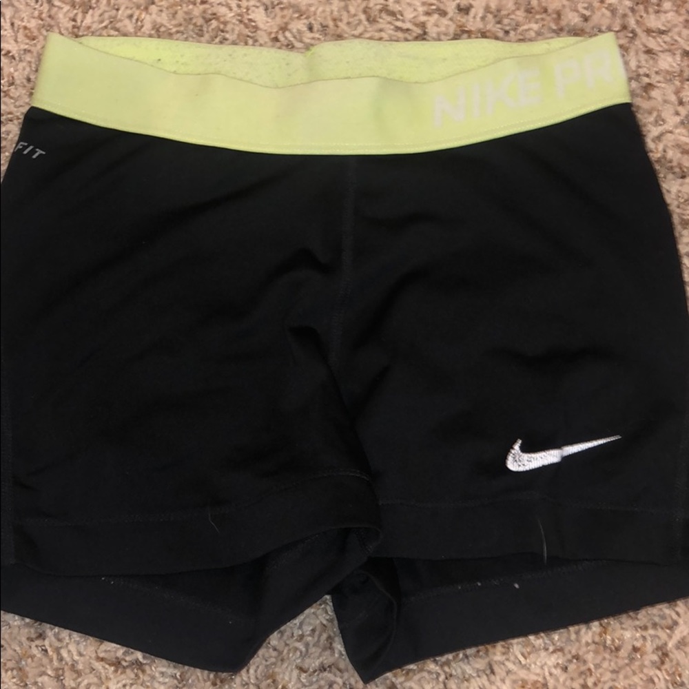 Black nike pros with neon band